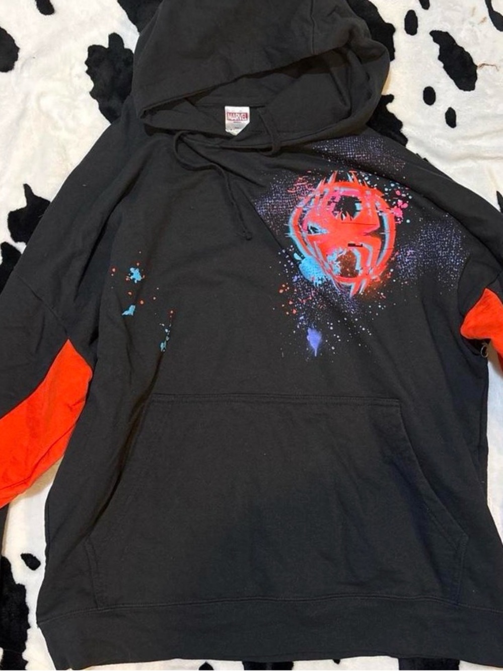 Black Hoodie with Red Accents and Graphic Splash